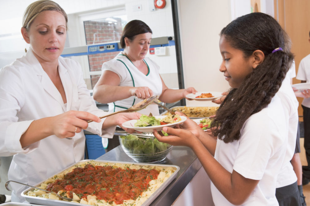 Girl getting school lunch