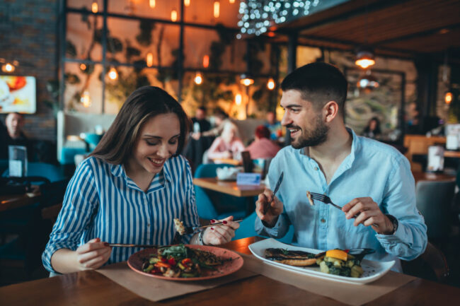 Couple eating at restaurant