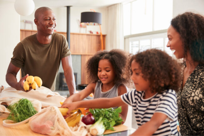 Family unpacking groceries