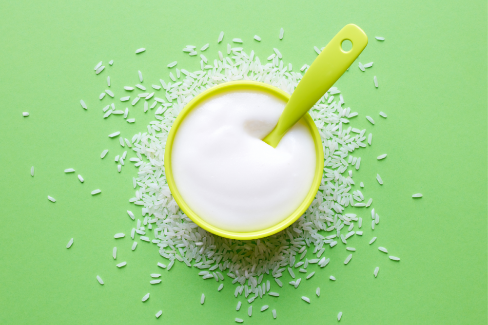 infant rice cereal on green background