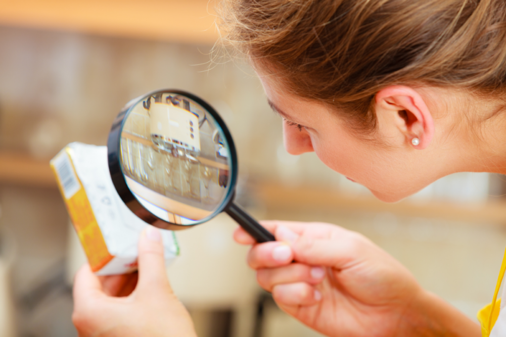 woman examining butter ingredient list