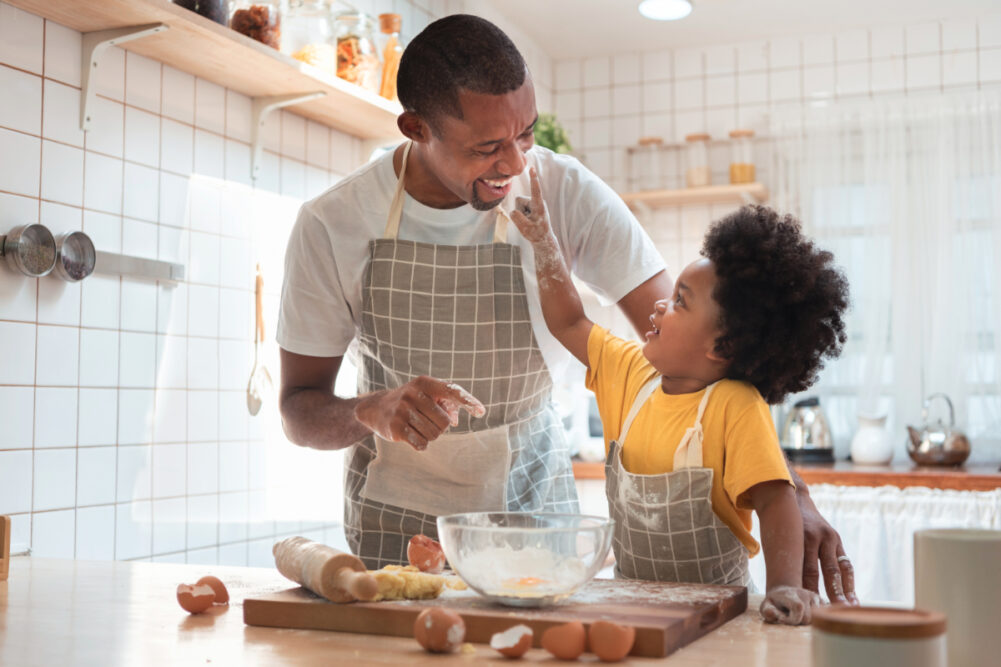 Father and son baking at home