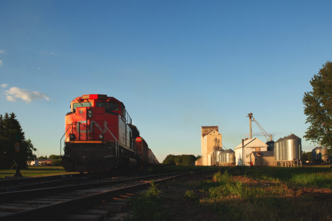 Train leaving grain elevator