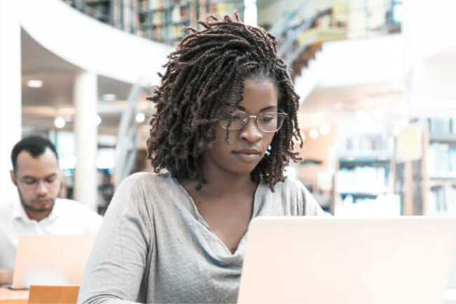 Black woman and Brown man studying