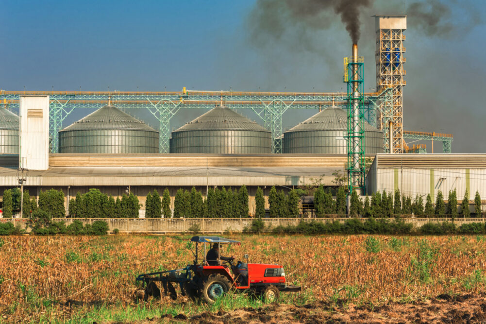 Agricultural silos with thick smoke from pipe emissions