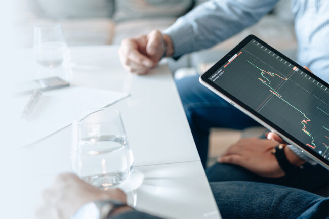 Investors monitoring stocks on a tablet