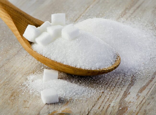 Spoonful of sugar, sugar cubes, wood spoon