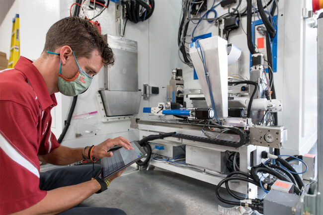 Technician with robotic dough loader