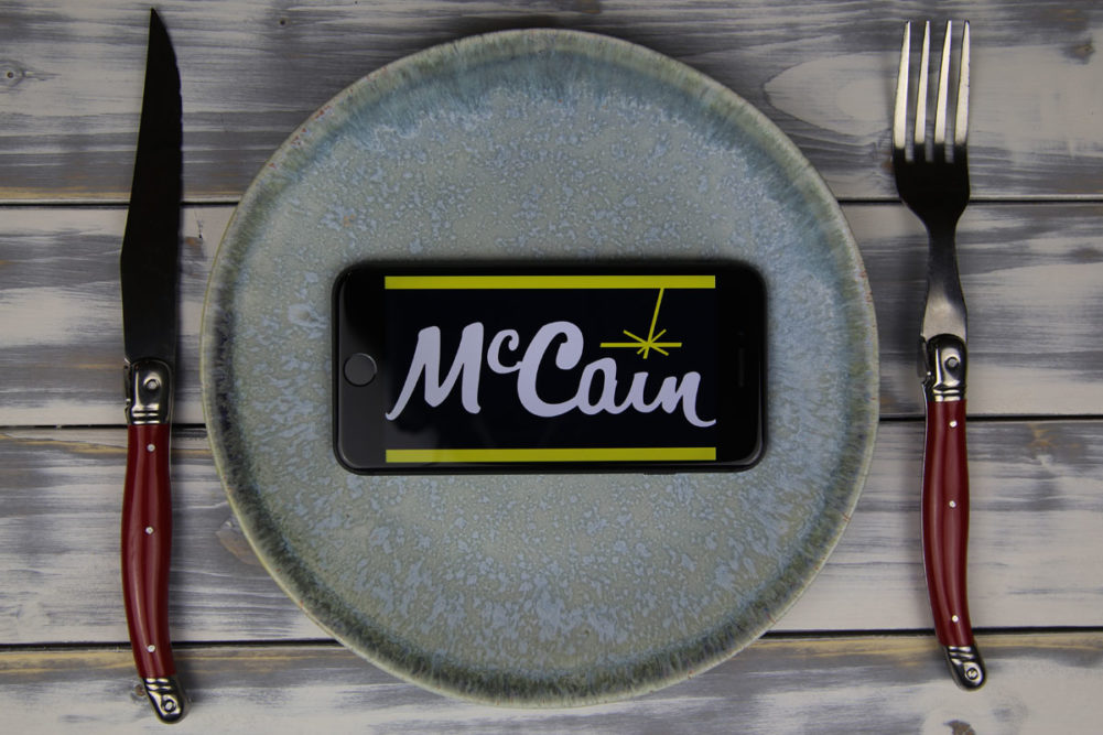 McCain Foods phone case, dinner plate, knife and fork.