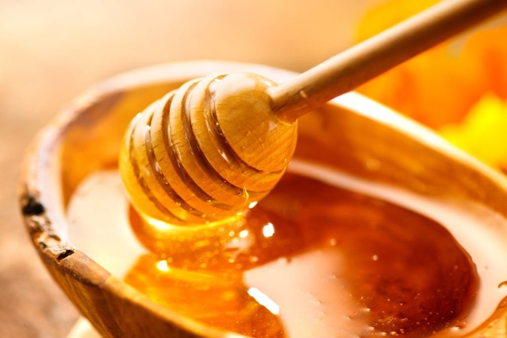 Honey in a wooden bowl.