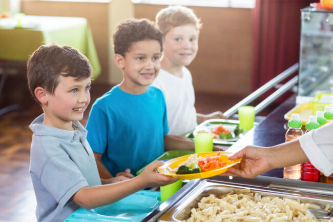 Children receiving school lunch. 