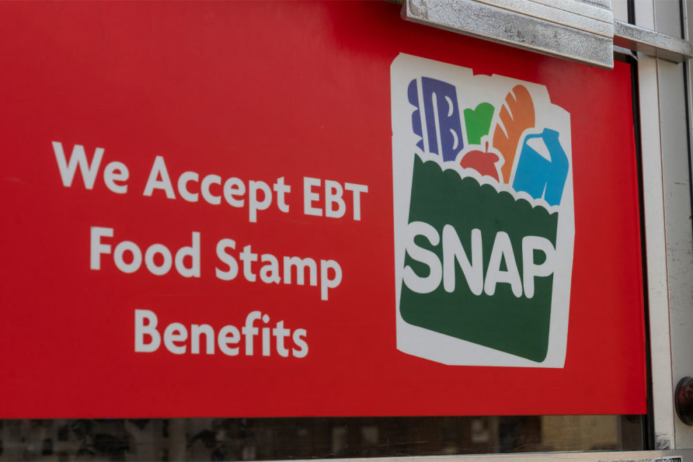 SNAP EBT sign outside grocery store. 