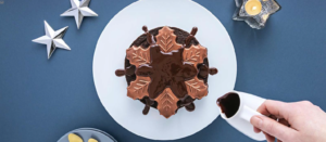 A chocolate cake with frosting on top

Description automatically generated