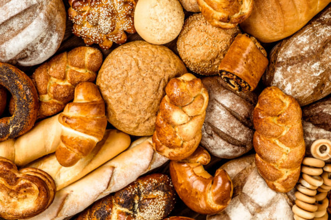 Assortment of baked foods and bread. 