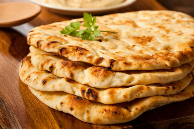 Stack of naan flatbread.