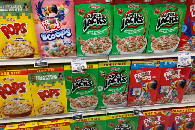 Assortment of WK Kellogg cereals on grocery store shelf. 