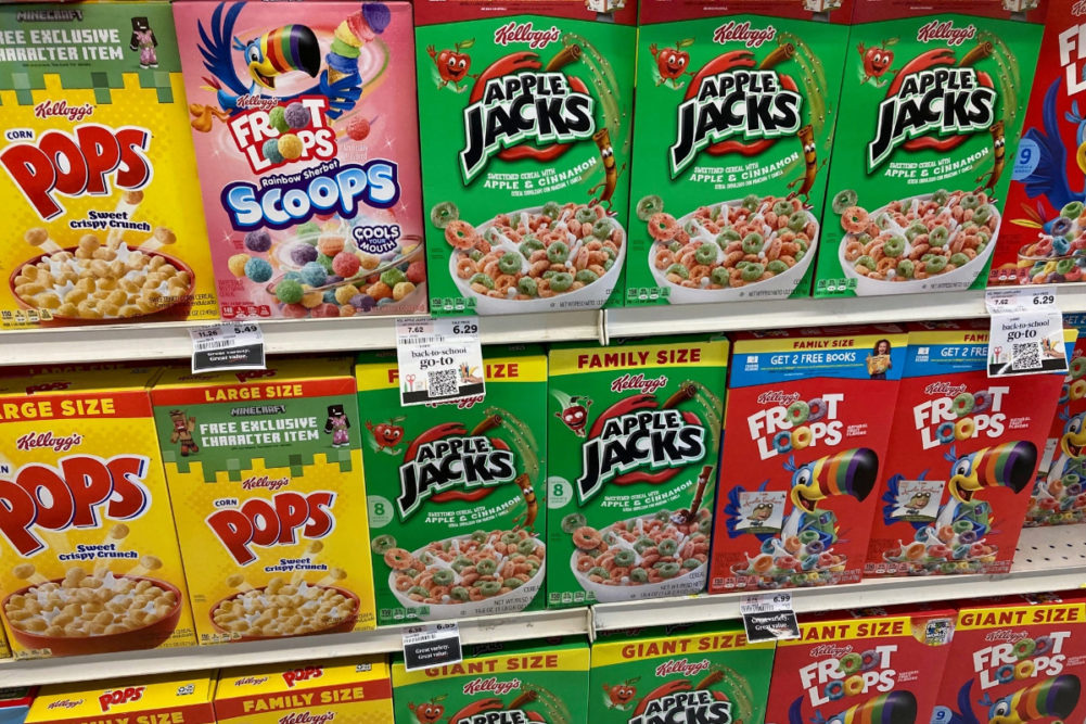 Assortment of WK Kellogg cereals on grocery store shelf. 