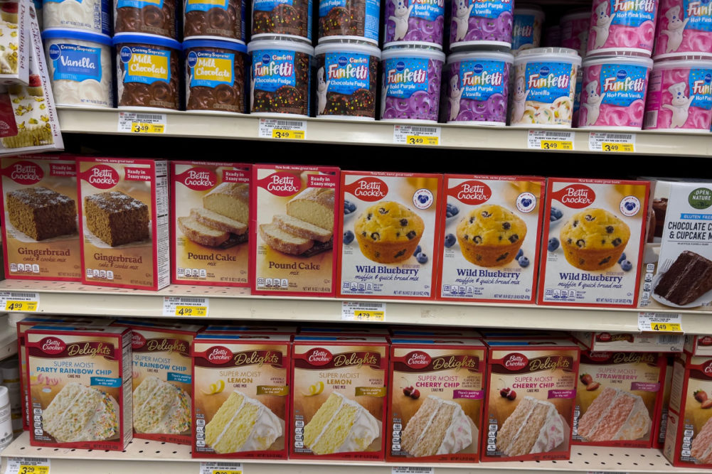 Assortment of General Mills baking products on grocery shelf.