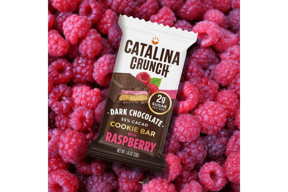 Catalina Crunch Cookie Bar on bed of raspberries. 