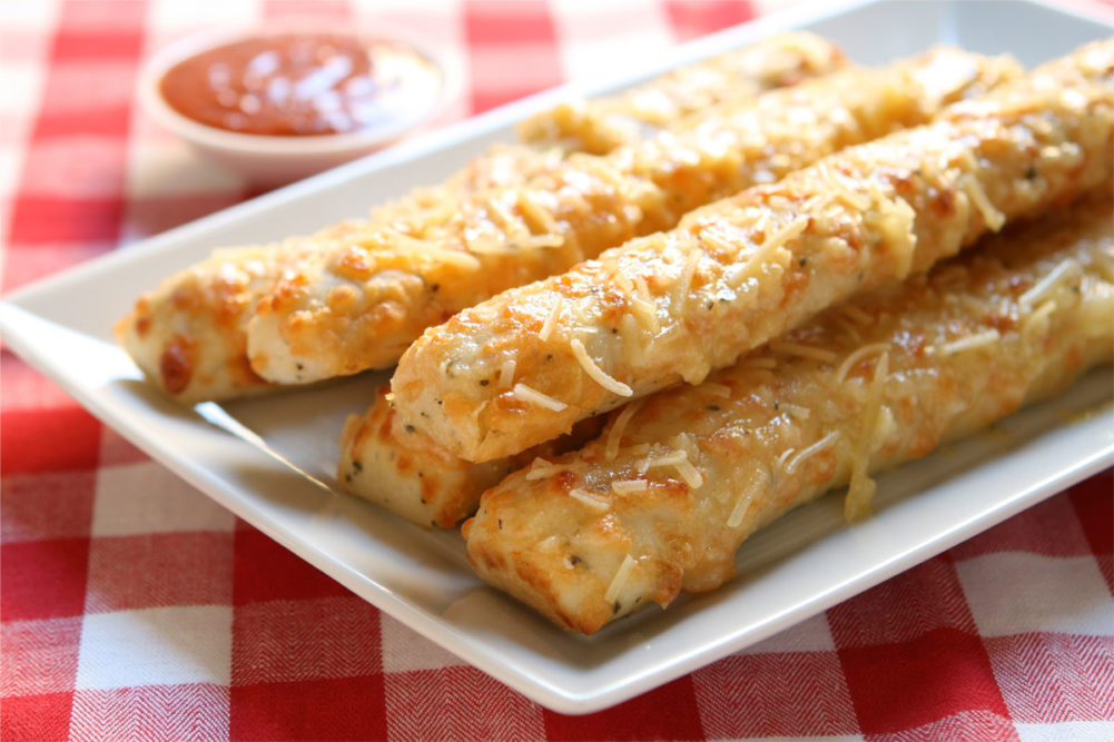 Plate of pizza breadsticks. 