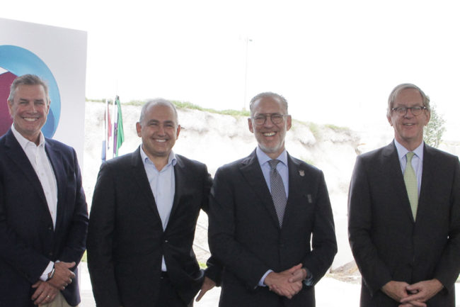 Corbion executives smile for ribbon cutting in Mexico. 