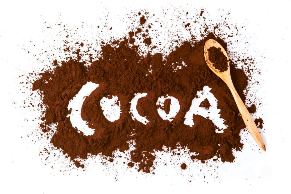 Cocoa spelled out with cocoa powder. 