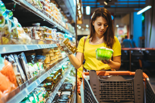 Woman shopping at grocery store.