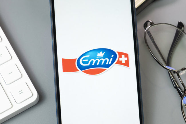 The Emmi Group logo on cellphone. 