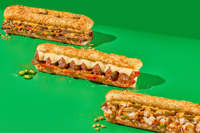 Subway new spicy breads on green background. 