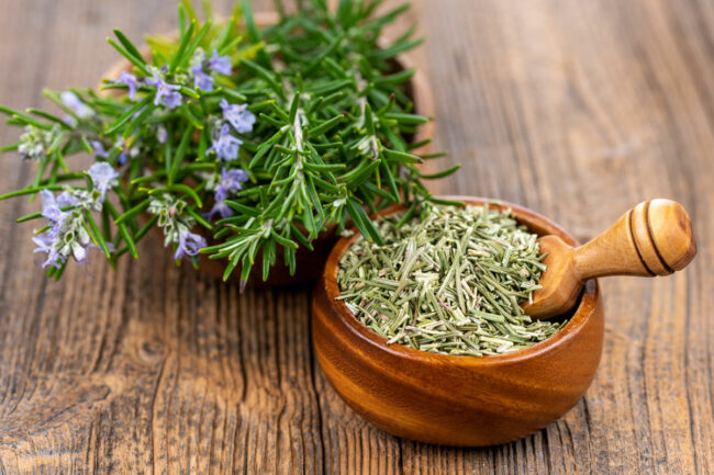 Morter and pestle of fresh rosemary.