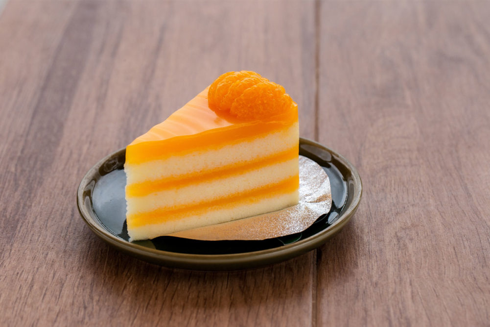 Piece of vivid orange cake. 