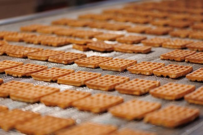 Waffles on assembly line. 