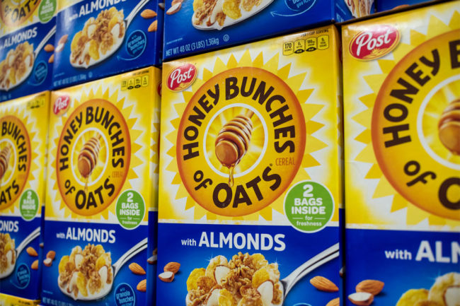 Boxes of Honey Bunches of Oats on grocery store shelf. 