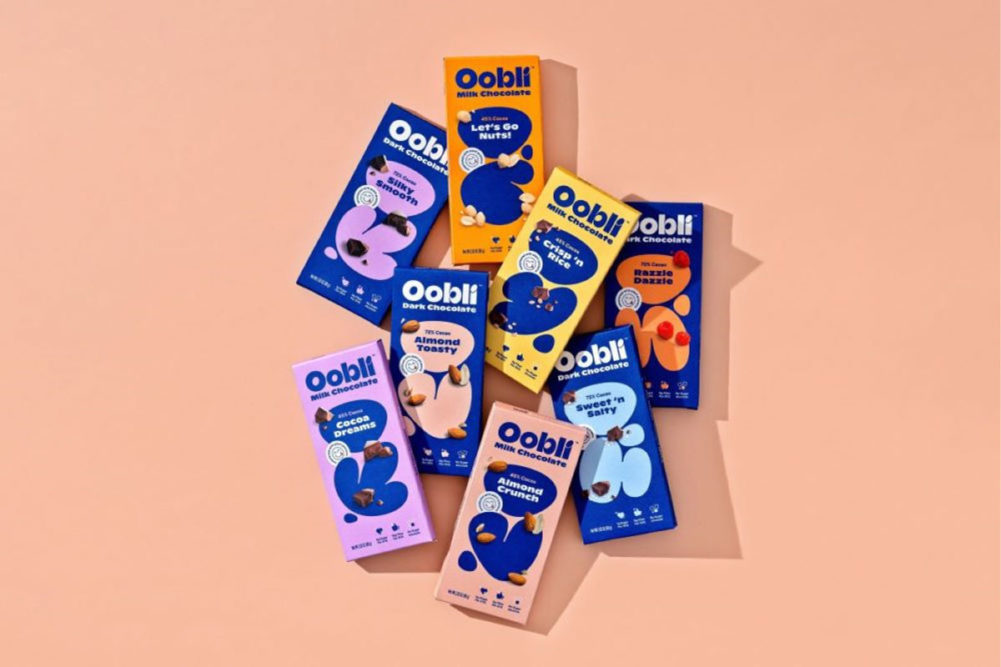 Oobli product line with coral colored background. 