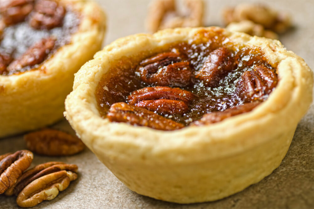 Close-up shot of pecan tart. 