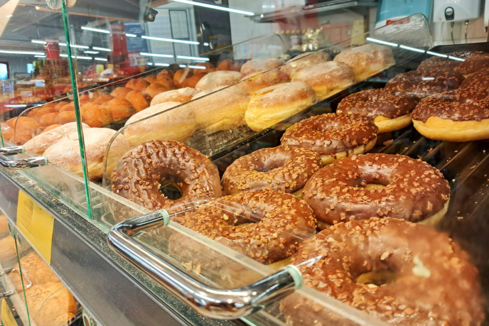 Assortment of donuts in casing. 